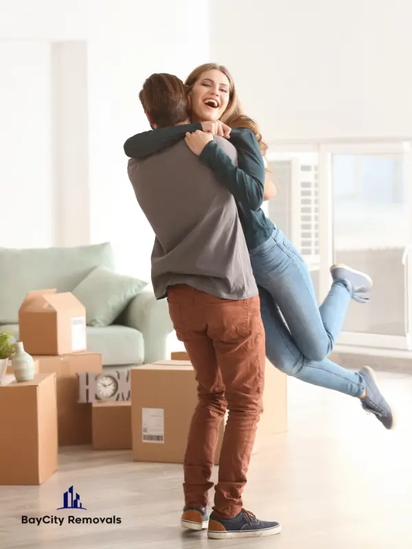 Bay City Removals Sunshine Coast to South East Queensland removalists loading furniture for a home move with protective wrapping